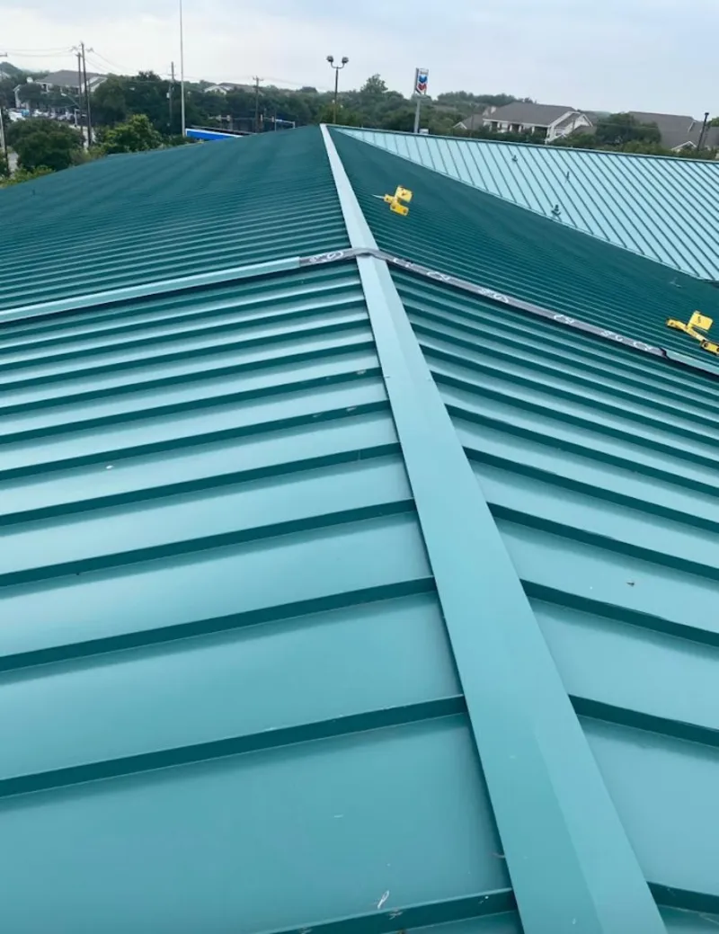 Green commercial metal roof ridge and valley for Metal Roof Repair in Cottleville