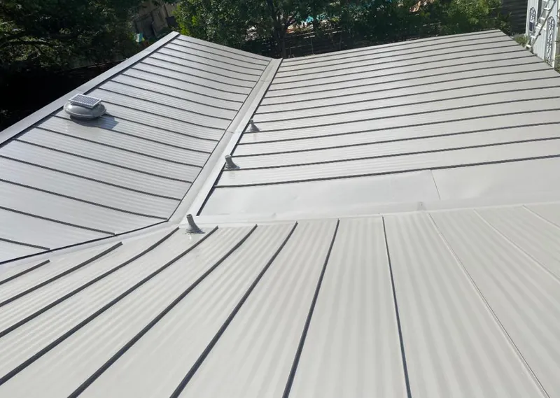 Solar attic fan installed on a metal roof for Roof Ventilation in Cottleville